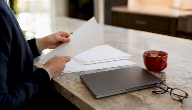 Hands arranging legal custody agreement documents