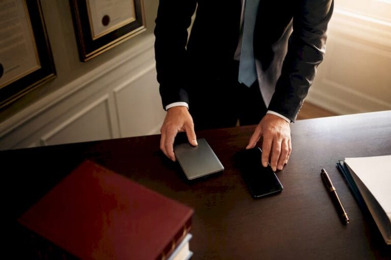 Hands organizing divorce case digital evidence