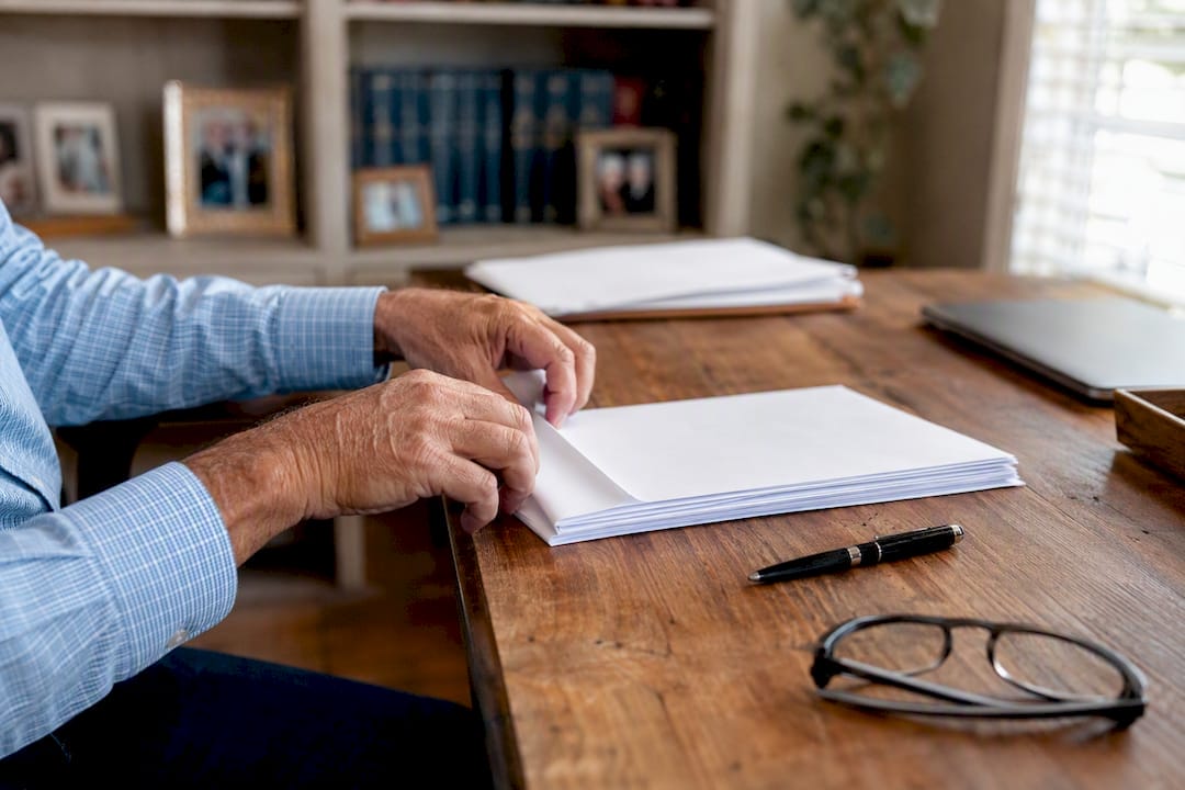 Hands preparing legal forms and Florida license