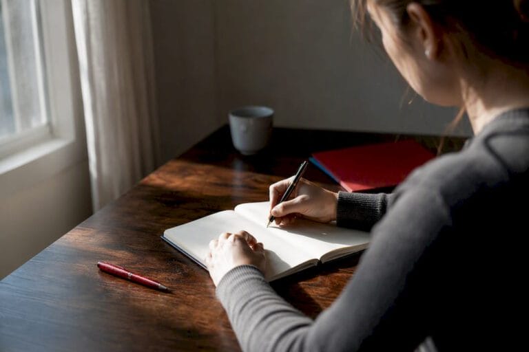 Hands writing a private incident log