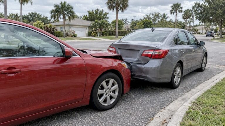 Cars with minor collision damage at intersection