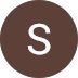 A brown circle with a white, capital letter "S" in the center.